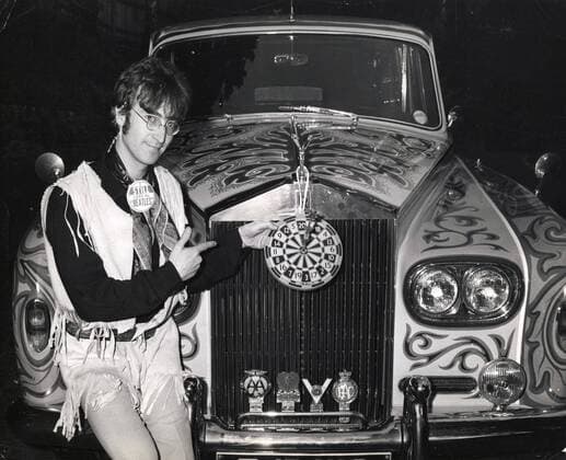 Aug 09, 1965; Waybridge, Surrey, UK; (File Photo: Date Unknown) Beatle lead singer JOHN LENNON stands beside his talked-about psychodelic Rolls Royce at his home. Waybridge UK  - ZUMAk09