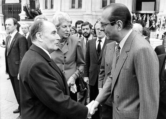 Apr 05, 1984 - Paris, France - After serving 18 years as the mayor of Paris, JACQUES CHIRAC was elected president of France in 1995 to succeed Francois Mitterrand. He held various high level government posts and elected offices throughout his career, including two terms as prime minister. As president he weathered criticism for inaction on domestic policies, for flip-flopping on matters of foreign policy and for his connections to political scandals involving fraud and corruption. His popularity at home surged when he strongly opposed George W. Bush s decision to invade Iraq in 2003, but dissatisfaction with his domestic policies eventually took their toll and by 2006 his support had dwindled; Chirac announced in March of 2007 that he would not seek a third term. PICTURED: Mayor of Paris JACQUES CHIRAC (right) shaking hands with French president FRANCOIS MITTERRAND during exhibit on Geor  - ZUMAk09