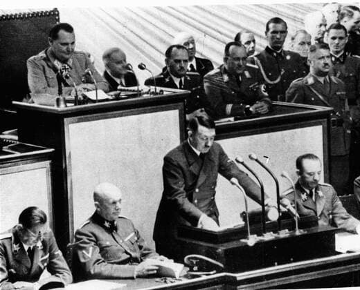 IMAGO History, Zweiter Weltkrieg: 1939 - 1945 Mar 19, 1938; Berlin, Germany; ADOLF HITLER (C) during a meeting at the Reichstag. Adolf Hitler (April 20, 1889-April 30, 1945) was the Führer und Reichskanzler (Leader and Imperial chancellor) of Germany from 1933 to his death. He was leader of the National Socialist German Workers Party (NSDAP), better known as the Nazi Party. At the height of his power, the armies of Nazi Germany and its Axis Powers dominated much of Europe during World War II. The racial policies that Hitler directed culminated in a massive number of deaths commonly cited at over 11 million people, including 6 million Jews, in a genocide now known as the Holocaust. Berlin Germany  - ZUMAk09