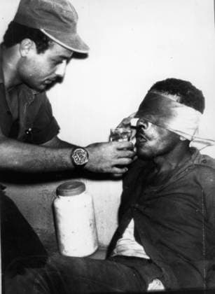 Oct 18, 1968; West Bank, Israel; Israeli sergent gives water to a captured FATAH member after the Israeli army faught FATAH militants that crossed the Jordan River into Israel. IRA, Red Brigades, Al Queda, Islamic Extremists, Insurgents. West Bank Israel  - ZUMAk09