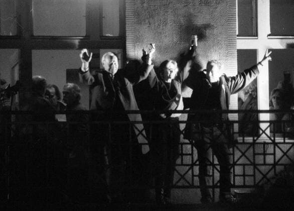 Prague, Velvet Revolution - November 24, 1989, Alexander Dubcek, the main creator of Prague Spring in 1968 which was crushed by the Red Army and other Warsau Pact forces invasion on August 21 1968, Vaclav Havel and Marta Kubisova open their arms to the crowd from the balcony of the Melantrich Building in Prague, Czechoslovakia on Nov. 24, 1989. 