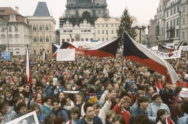 Prague, Velvet Revolution, Old Town Square December 11th 1989. High School students and teachers waving Czech flags manifest to support the recent political change. 