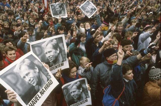 Prague, Velvet Revolution, Old Town Square, December 11th 1989. High School students and teachers holding posters of Vaclav Havel manifest to support the recent political change. 