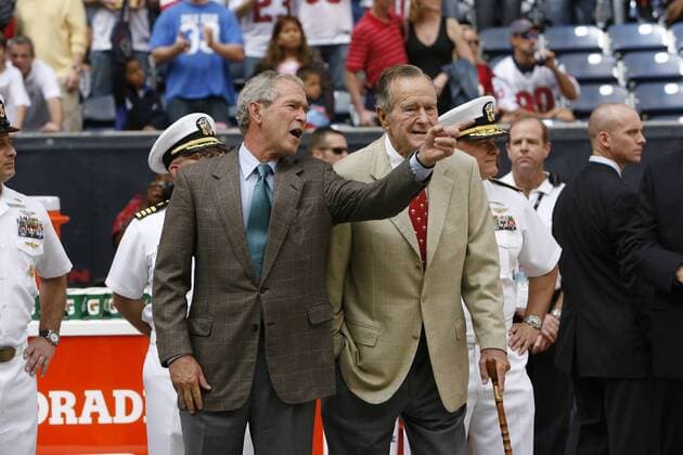 25 October 2009: Former U.S. Presidents George W. Bush, left, and George H.W. Bush on the sidelines prior to the San Francisco 49ers vs. Houston Texans football game at Reliant Stadium on Sunday October 25, 2009 in Houston, Texas. Houston won 24-21. EDITORIAL USE ONLY 112308