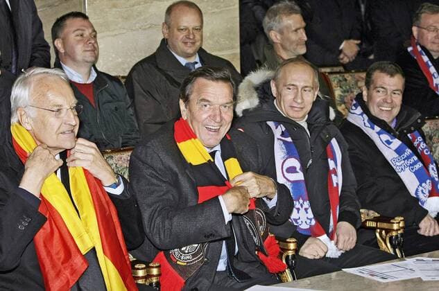ITAR-TASS 29: MOSCOW, RUSSIA. OCTOBER 11, 2009. Edmund Stoiber, German politician, former premier of Bavaria, Gerhard SchrÃ¶der, chairman of Nord Stream shareholders committee and former German chancellor, PM Vladimir Putin, Russian president Dmitry Medvedev (L-R front) support the Russian team at Fifa World Cup 2010 Qualifying match between Russia vs. Germany at the Luzhniki Arena.  Highlight TASS_1044448