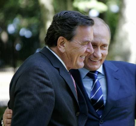 ITAR-TASS 32: KALININGRAD REGION, RUSSIA. JULY 3. German Chancellor Gerhard SchrÃ¶der (L) and President Vladimir Putin share a smile during their talks in the town of Svetlogorsk, Russia s Kaliningrad Region.  TASS_166196