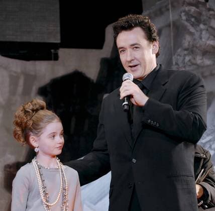 Actress Morgan Lily (L) and actor John Cusack attend a Japan premiere for the film 2012 at Tokyo, Japan, on November 17, 2009.  TKP2009111724