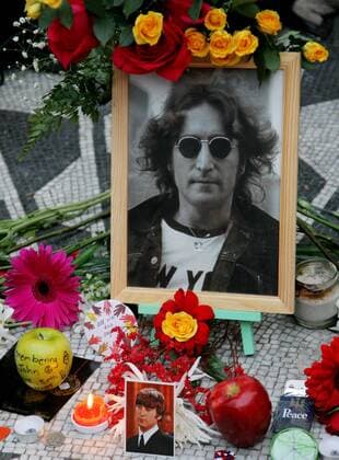A portrait of John Lennon is among the items left on the Imagine memorial mosaic as fans gather at Strawberry Fields in Central Park to pay tribute to the musician on December 8, 2009 in New York City. The former Beatles singer and songwriter was shot outside of his home twenty-nine years ago by Mark David Chapman, a deranged fan. UPI Monika Graff  NYP20091208311