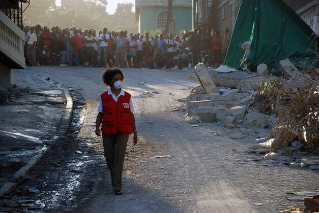 A Red Cross volunteer is seen as search and rescue operation are underway in Port-au-Prince, Haiti on January 15, 2010. A 7.0 magnitude earthquake hit Haiti on January 12, devastating the country s capital and surrounding cities.  WAX20100119711