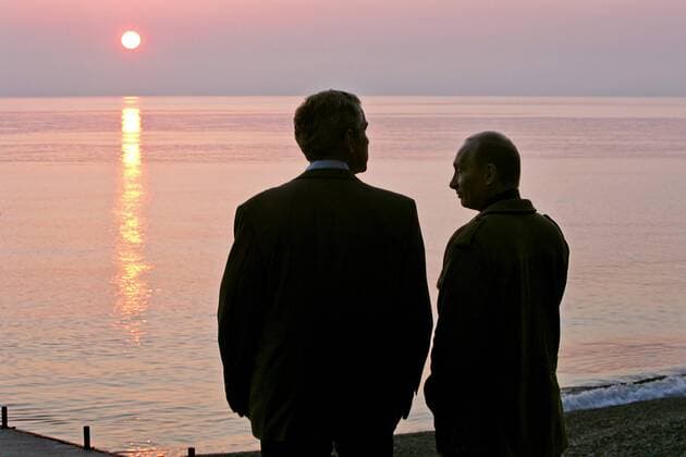 ITAR-TASS 06: SOCHI, RUSSIA. APRIL 6. President George W. Bush (L) and his Russian counterpart Vladimir Putin watch the sunset at the Bocharov Ruchei residence at the Black Sea.  Highlight TASS_585895