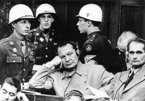 GERMANY. Reichsmarschall Hermann GÃ¶ring (C), and Hitler s deputy leader Rudolf Hess (R) during their trial in Nuremburg, 1945.  TASS_435162
