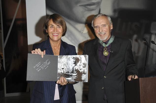 US actor Dennis Hopper (R) poses with French Culture minister Christine Albanel (R), on October 13, 2008 in Paris, after receiving the Commandeur of the Ordre des Arts et des Lettres award on the sideline of the avant-premiere of the exhibition Dennis Hopper et le nouvel Hollywood (Dennis Hopper and the new Hollywood) held at Paris Cinematheque, the French Film Library. 