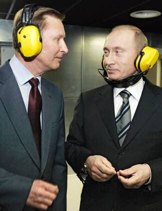 ITAR-TASS 84: MOSCOW, RUSSIA. NOVEMBER 8. Russian Defence Minister Sergei Ivanov and Russian President Vladimir Putin, L-R, wear ear defenders on a visit to a new headquarters of the Main Intelligence Agency (GRU) of the Russian Armed Forces General Staff.  379648