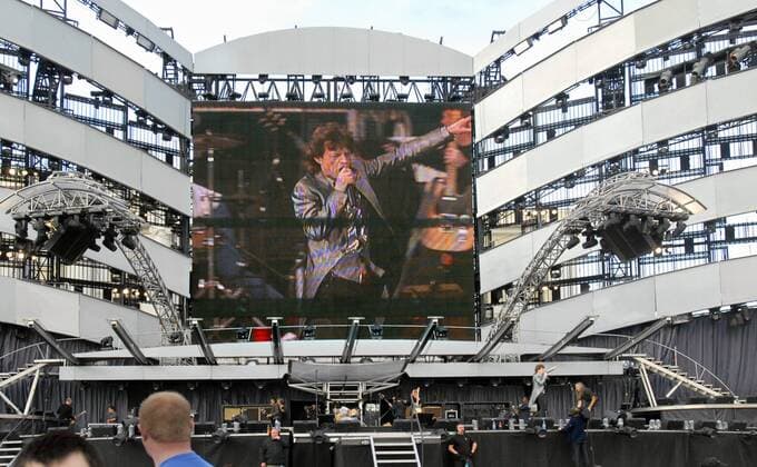 ITAR-TASS 20: ST.PETERSBURG, RUSSIA. JULY 29. The Rolling Stones frontman Mick Jagger performing on big videoscreen at an outdoor live concert in Palace Square (Dvortsovaya), St.Petersburg.  496879