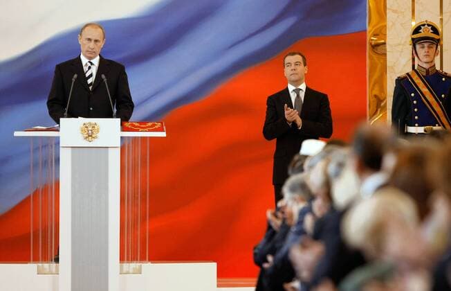 ITAR-TASS 113: MOSCOW, RUSSIA. MAY 7. Russian president Dmitry Medvedev (C) and Vladimir Putin (L) appear in the Cathedral Square in the Kremlin.  598522
