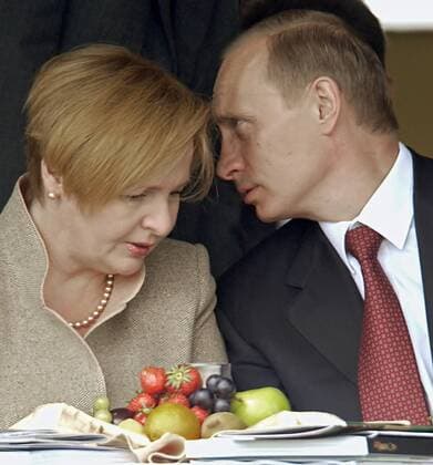 TAS 32. MOSCOW,RUSSIA. JULY 3. Russian President Vladimir Putin talks with his wife Lyudmila during the first horse-races for the Prize of the Russian President held at the Moscow Hippodrome to-day.  123929