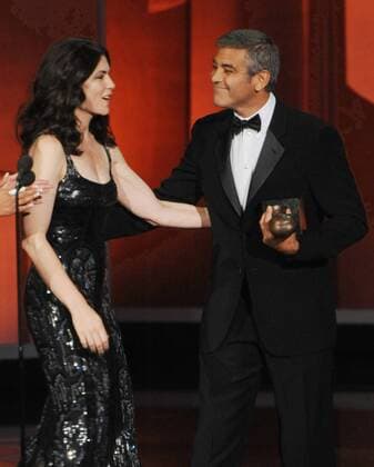 George Clooney accepts the Bob Hope Humanitarian Award from presenter Julianna Margulies , during the 62nd annual Primetime Emmy Awards at the Nokia Theatre in Los Angeles on August 29, 2010.  LAP20100829615