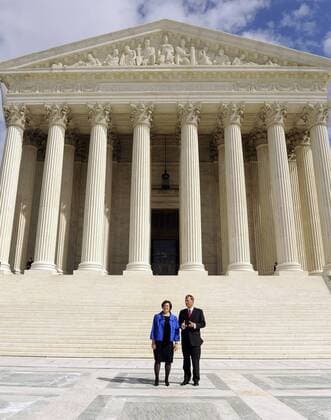 Supreme Court Justice Elena Kagan and Chief Justice John Roberts stand in front of the Supreme Court following her investiture ceremony in Washington on October 1, 2010.  WAP2010100133