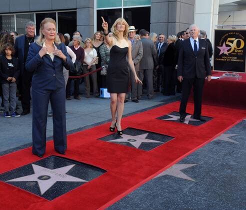 Actress Laura Dern (C), her father, actor Bruce Dern (R) and mother, actress Diane Ladd (L) participate in an unusual triple-star unveiling ceremony where they were each honored with a star on the Hollywood Walk of Fame in Los Angeles on November 1, 2010.  LAP2010110113