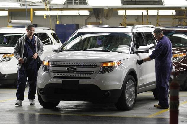 Workers inspect a Ford Explorer at Ford s Chicago Assembly Plant on December 1, 2010 in Chicago. Ford spent nearly Dollar 400 million to renovate its Chicago facility to produce the all-new 2011 Explorer along with the Ford Taurus and Lincoln MKZ.  CHI2010120123