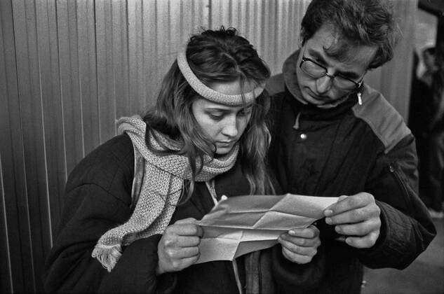 Young couple reads a leaflet in a PragueÃ‚Â s metro station during the Velvet Revolution in November 1989. CTK Photo Jaromir Cejka  CTKPhoto200910301214301