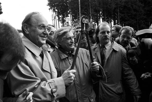 West German foreign minister Hans-Dietrich Genscher, left, and his Czechoslovak counterpart Jiri Dienstbier, centre, symbolically cut barbed wire fence near Rozvadov at Czechoslovak-Austrian border after the Velvet revolution toppled communist regime in Czechoslovakia, December 23, 1989 CTK Photo Jiri Berger  CTKPhoto00113753