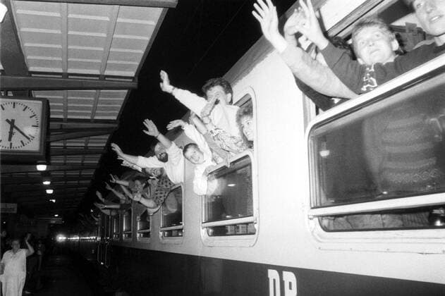 East Germans refugees from the West German Embassy in Prague wave from a special train as they leave for West Germany in October 1989 following an agreement between the Federal Republic of Germany and the German Democratic Republic. Some 20,000 East Germans fled to West Germany via the embassy between August and November 1989. CTK Photo  CTKPhoto00130864