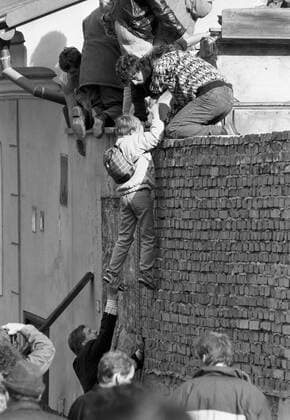East German citizens climb over the wall to seek refuge at the West German Embassy in Prague in October 1989. CTK Photo  CTKPhoto00133327