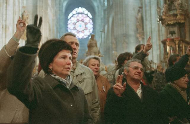 Believers flash V for victory signs inside St. Vitus Cathedral as Prague Archbishop cardinal Frantisek Tomasek celebrates a mass on the occasion of canonization of St. Agnes of Bohemia during Czechoslovakia s Velvet Revolution on November 25, 1989. CTK Photo Karel Mevald  CTKPhoto00014271