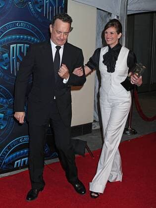 Tom Hanks and Julia Roberts arrive on the red carpet after Roberts received the Board of Governors Award during the 25th annual American Society of Cinematographers Awards in the Hollywood section of Los Angeles on February 13, 2011.  LAP20110213723