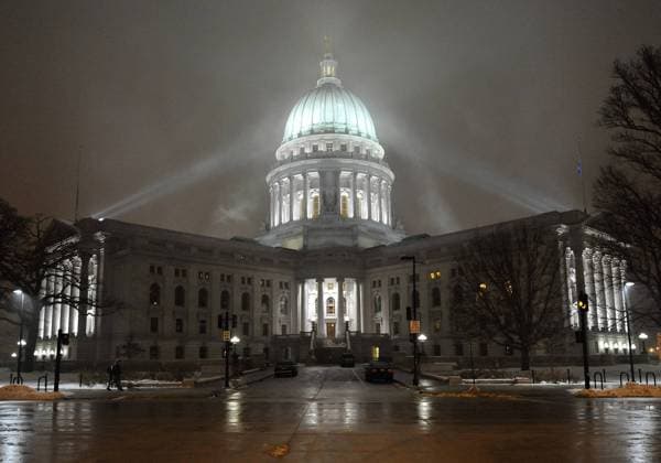 The Wisconsin state capitol is lit up late into the evening in Madison, Wisconsin on February 23, 2011. Inside the building, thousands are staging a 24-hour protest of the state budget proposed by Republican Gov. Scott Walker, which includes cuts in benefits for state workers and takes away many of their collective bargaining rights.  BKX2011022328