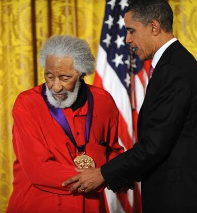United States President Barack Obama helps Sonny Rollins leave the stage after presenting the jazz legend the 2010 National Medal of Arts in the East Room of the White House in Washington, DC on March 2, 2011. The annual awards are managed by the National Endowment for the Arts.  WAP20110302139