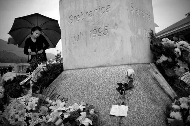 BOSNIA AND HERCEGOVINA , POTOCARI 11 07 2009 From 11th July 1995 in Srebrenica, the safe zone protected by UN forces Serbs killed in ethnic cleansing more than 8000 Bosniak man. Dozen years after the largest genocide in Europe since World War II mass graves are still being found and exhumed, in the mortuaries thousands of bodies await for identification, funerals take place, families of the victims wish to bury and mourn their relatives. HERE Cemetery in Potocari where the victims of the massacre are buried. EN_00922060_0037 