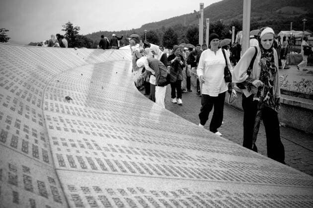 BOSNIA AND HERCEGOVINA , POTOCARI 11 07 2009 From 11th July 1995 in Srebrenica, the safe zone protected by UN forces Serbs killed in ethnic cleansing more than 8000 Bosniak man. Dozen years after the largest genocide in Europe since World War II mass graves are still being found and exhumed, in the mortuaries thousands of bodies await for identification, funerals take place, families of the victims wish to bury and mourn their relatives. HERE Cemetery in Potocari where the victims of the massacre are buried. EN_00922060_0033 