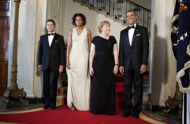 From right, U.S. President Barack Obama, Angela Merkel, chancellor of Germany, First Lady Michelle Obama and Joachim Sauer, Merkel s husband, poses for a portrait at the White House in Washington, D.C., U.S., on Tuesday, June 7, 2011. PhotographerxJoshuaxRobertsx xBloombergx 