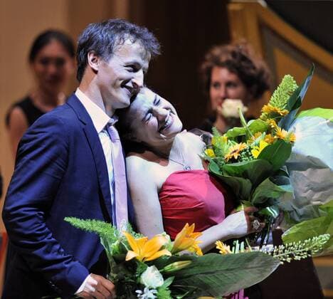 Italian mezzo-soprano Cecilia Bartoli, right, and French conductor Jean-Christophe Spinosi, left, enjoy ovations after their concert at the Rudolfinum in Prague Thursday, June 9, 2011. Accompanied by Ensemble Matheus, Bartoli presented her Vivaldi Ritrovato project. (CTKxPhoto MichalxDolezal)  CTKPhoto161201106091077701
