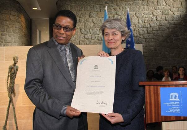 (110722) -- PARIS, July 22, 2011 (Xinhua) -- UNESCO Director-General Irina Bokova (R) and Jazz musician Herbie Hancock show the appointment certificate at a ceremony nominating him as the UNESCO goodwill ambassador in Paris, France, on July 22, 2011. UNESCO Director-General Irina Bokova appointed Herbie Hancock as a goodwill ambassador of the UNESCO (United Nations Educational, Scientific and Cultural Organization) at the UNESCO headquarters in Paris on Friday. (Xinhua Shu Shi) FRANCE-PARIS-UNESCO-HANCOCK-GOODWILL AMBASSADOR 