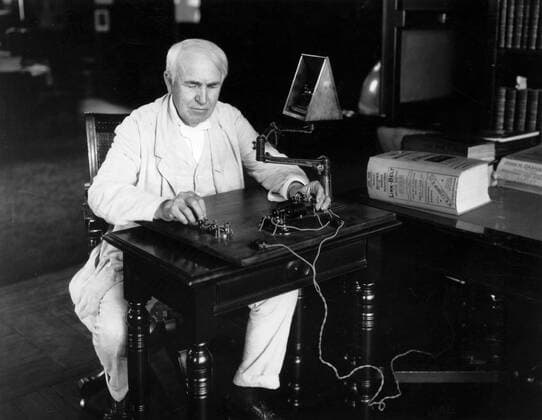 Edison seated at Telegraph key 1920 28th July 1920 Edison National Historic Site Orange New Jersey Edison, Thomas Alva (the Wizard of Menlo Park) US inventor; opened research laboratory in Menlo Park, New Jersey 1876 (moved to West Orange, New Jersey 1887); invented phonograph (1st demonstrated 1877); invented incandescent electric light 1879; invented kinetograph camera and kinetoscope motion-picture viewer (patented 1891) _1847-1931 Mono Print UnitedArchives0813685