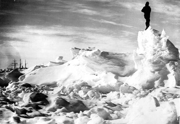 Endurance Ship in background. In 1916, Sir Ernest Shackleton s ship Endurance became crushed in the ice floes. Captain Sir Ernest Henry Shackleton (1874-1922) was an Anglo-Irish explorer, now chiefly remembered for his Antarctic expedition of 1914-1916 in the ship Endurance. From Antarctica: The Last Continent by Ian Cameron page 65. Local Caption Exploration 1 Mono Print UnitedArchives0542059