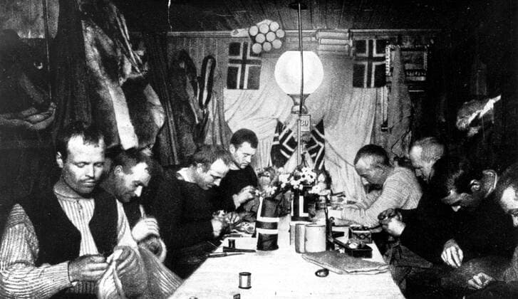Evening in Amundsen s winter quarters (left to right). Bjaaland, Hassel, Wisting, Helmer Hanssen, Amundsen, Johansen, Prestrud and Stubberud. Roald Engelbregt Gravning Amundsen (1872-1928) was a Norwegian explorer of polar regions. He led the Antarctic expedition of 1910-1912 in the ship Fram, which was the first to reach the South Pole. Antarctica: The Last Continent by Ian Cameron, page 168. Local Caption Mono Print UnitedArchives0649165