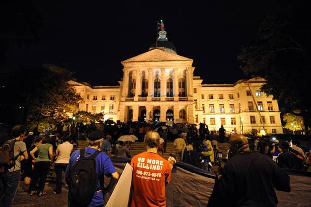 Demonstrators call for Georgia state officials to halt the scheduled execution of convicted killer Troy Davis at the state capitol in Atlanta, Georgia, on Tuesday, September 20, 2011. Davis is schedule to die Wednesday, September 21st, for the 1989 murder of a Savannah police officer, although several witnesses have recanted their trial statements.  ATL2011092019512