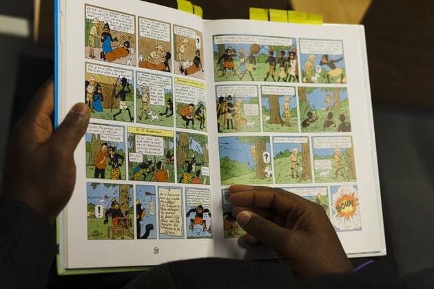 Brussels court of justice: Bienvenu Mbutu Mondondo and the association Le Cran want the book Tintin in the Congo to be banned in Belgium, for its racist portrayal of Africans. Bienvenu pointing out racist scenes. 