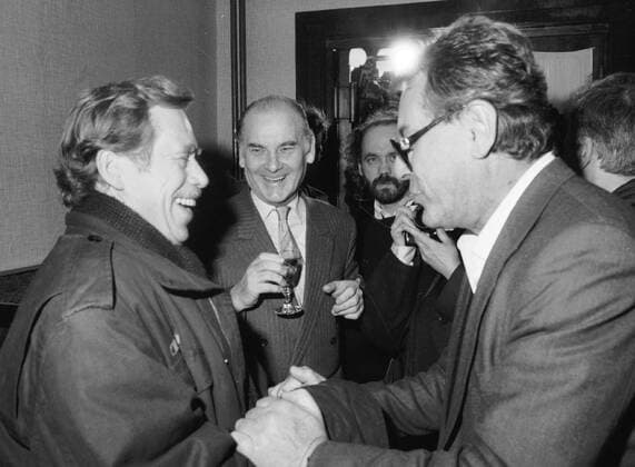 Civic Forum leader Vaclav Havel, left, meets his long-time friend Milos Forman, Czech Oscar-winning film director, at the screening of his film Valmont in Prague on December 15, 1989. Forman, who became a naturalized citizen of the United States in 1977, came to Czechoslovakia to support the Velvet Revolution. Czech Oscar-winning costume designer Theodor Pistek smiles in the middle.Vaclav Havel died on Sunday, Dec. 18, 2011, aged 75. Havel, a dissident playwright jailed by Communists, became Czechoslovak and than Czech president and a symbol of peace and freedom after bringing down communism in Czechoslovakia by leading bloodless Velvet Revolution .  CTKPhoto46900473404