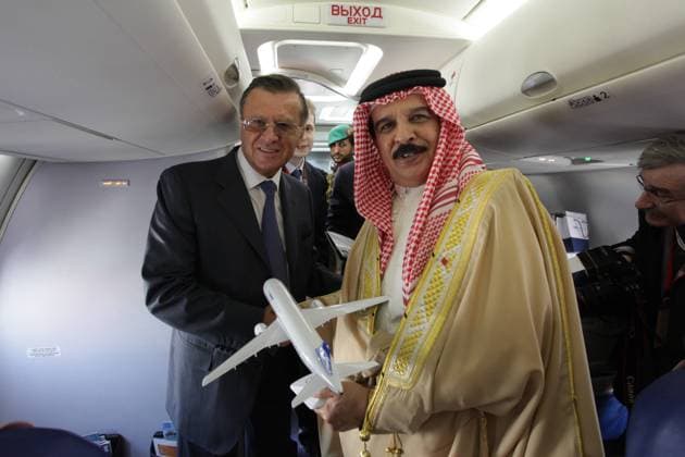 ITAR-TASS: MANAMA, BAHRAIN. JANUARY 20, 2012. Russian first deputy prime minister Viktor Zubkov (L) and King of Bahrain Hamad bin Isa Al Khalifa inside the Sukhoi Superjet 100 at the 2nd Bahrain International Air Show.  premiumd RE0F6153