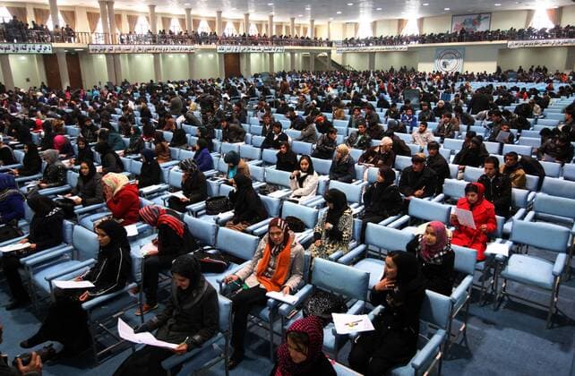 (120220) -- KABUL, Feb. 20, 2012 (Xinhua) -- Afghan graduates attend the university entry exam in Kabul, capital of Afghanistan, Feb. 20, 2012. The first phase of university entry exam was held in Kabul on Monday and over 12,000 high school graduates including 5,500 girls took part to find their way for higher education, according to Afgan Deputy Minister for Higher Education on student affairs Barai Siddiqi. (Xinhua Ahmad Massoud) (dzl) AFGHANISTAN-KABUL-UNIVERSITY ENTRY EXAM 