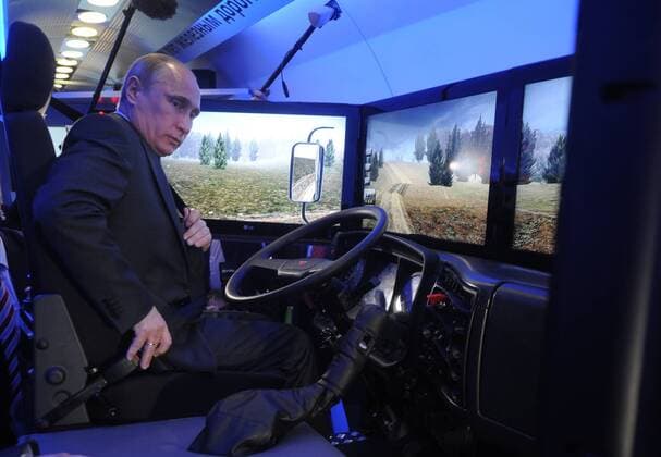 ITAR-TASS: MOSCOW, RUSSIA. APRIL 26, 2012. Russia s prime minister, president elect Vladimir Putin views a KamAZ locomobile simulator at an exhibition organised by the RZD Russian Railways Scientific and Technological Centre on a train at Moscow s Rizhsky Railway Station.  RE0FD333