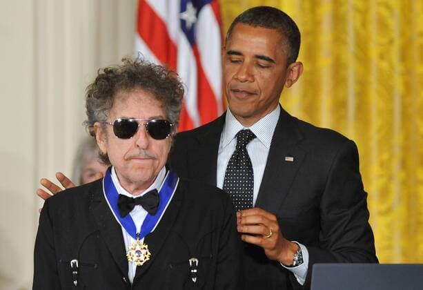 President Barack Obama awards the the Presidential Medal of Freedom to singer songwriter Bob Dylan during a ceremony in the East Room at the White House in Washington on May 29, 2012. The Medal of Freedom is our NationÕs highest civilian honor, presented to individuals who have made especially meritorious contributions to the security or national interests of the United States, to world peace, or to cultural or other significant public or private endeavors.  WAP20120529303