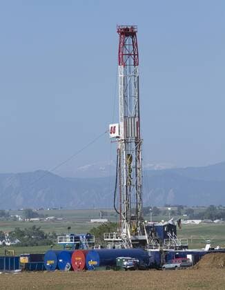 An Ensign Energy company drill site sits near the Rocky Mountains at the Niobrara oil shale formation in Weld County, North eastern Colorado on May 30, 2012. Gas and oil companies are using large amounts of water to obtain shale oil and gas in a process called hydraulic fracturing or fracking.  DEN2012053001