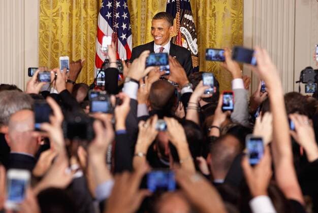 A sea of cell phones snap pictures as U.S. President Barack Obama hosts a reception in honor of national Gay, Lesbian, Bisexual and Transgender Pride Month in the East Room of the White House June 15, 2012 in Washington, DC. In the midst of a re-election campaign against former Massachusetts Gov. Mitt Romney, Obama s recent declaration of support for same-sex marriage was celebrated as a key endorsement among gay rights groups.  WAX20120615206
