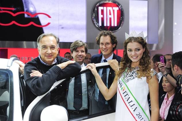Fiat Chrysler chief executive Sergio Marchionne (L), Fiat Chrysler Chief Marketing Officer Olivier Francois (C) , Fiat Chairman John Elkann (2R) and Miss Italy 2012 Giusy Buscemi present a Fiat Panda 4x4 at the Paris Motor Show Mondial de l Automobile in Paris, France, 27 September 2012. 